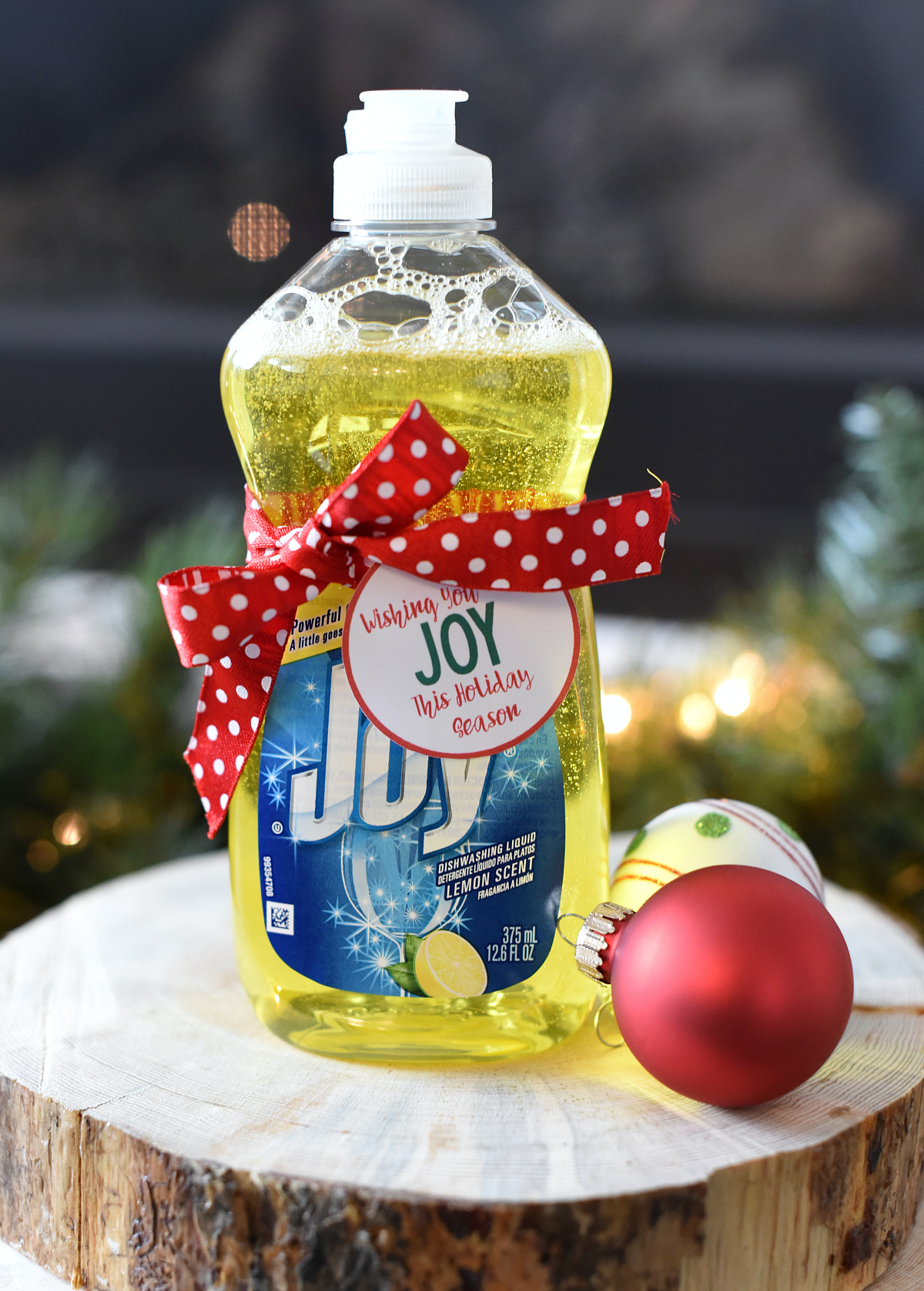 Wishing You JOY This Holiday Season-this easy neighbor gift is perfect. Add a tag to a bottle of Joy dish soap and you've got a fun, punny and useful neighbor gift. #christmas #giftideas #neighborgifts